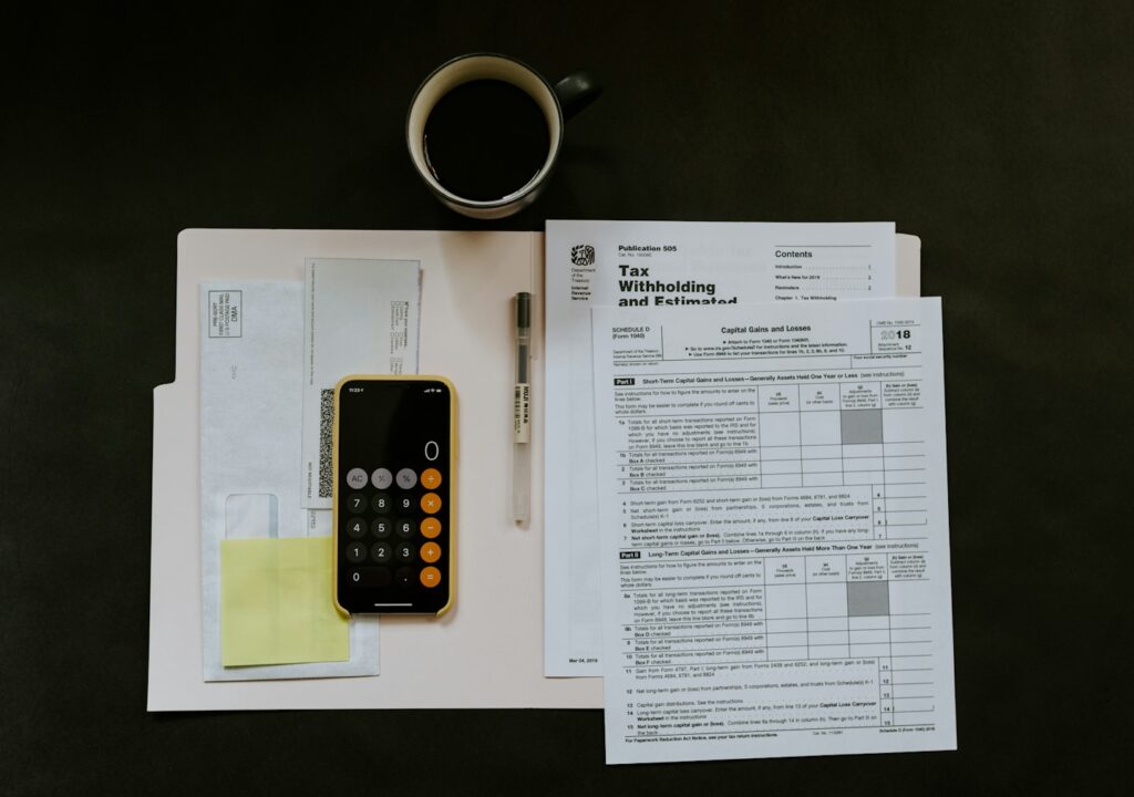 Financial documents and a pen illustrating small business bookkeeping in Tampa