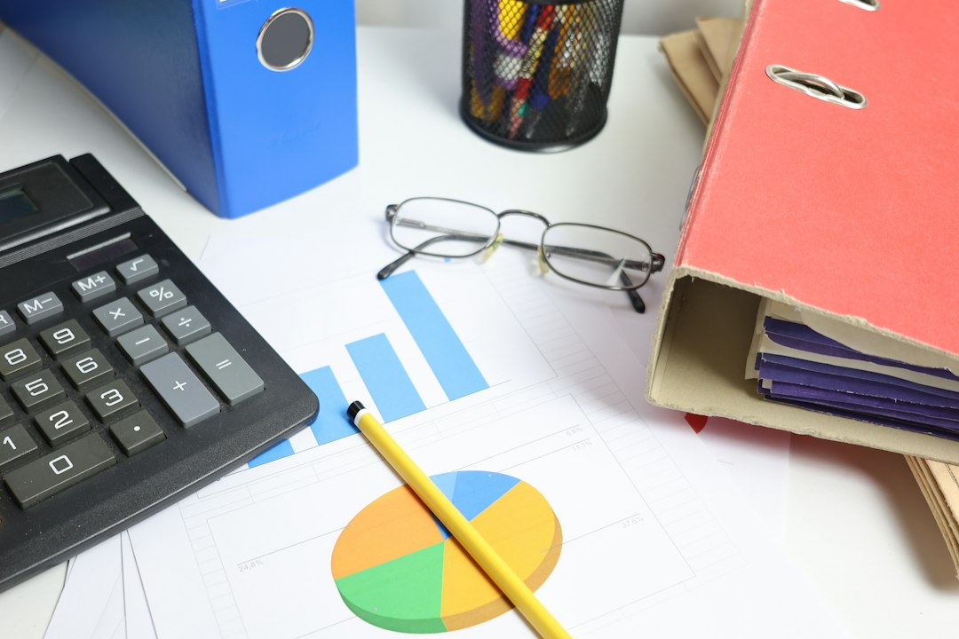Organized financial reports and calculator on a professional office desk